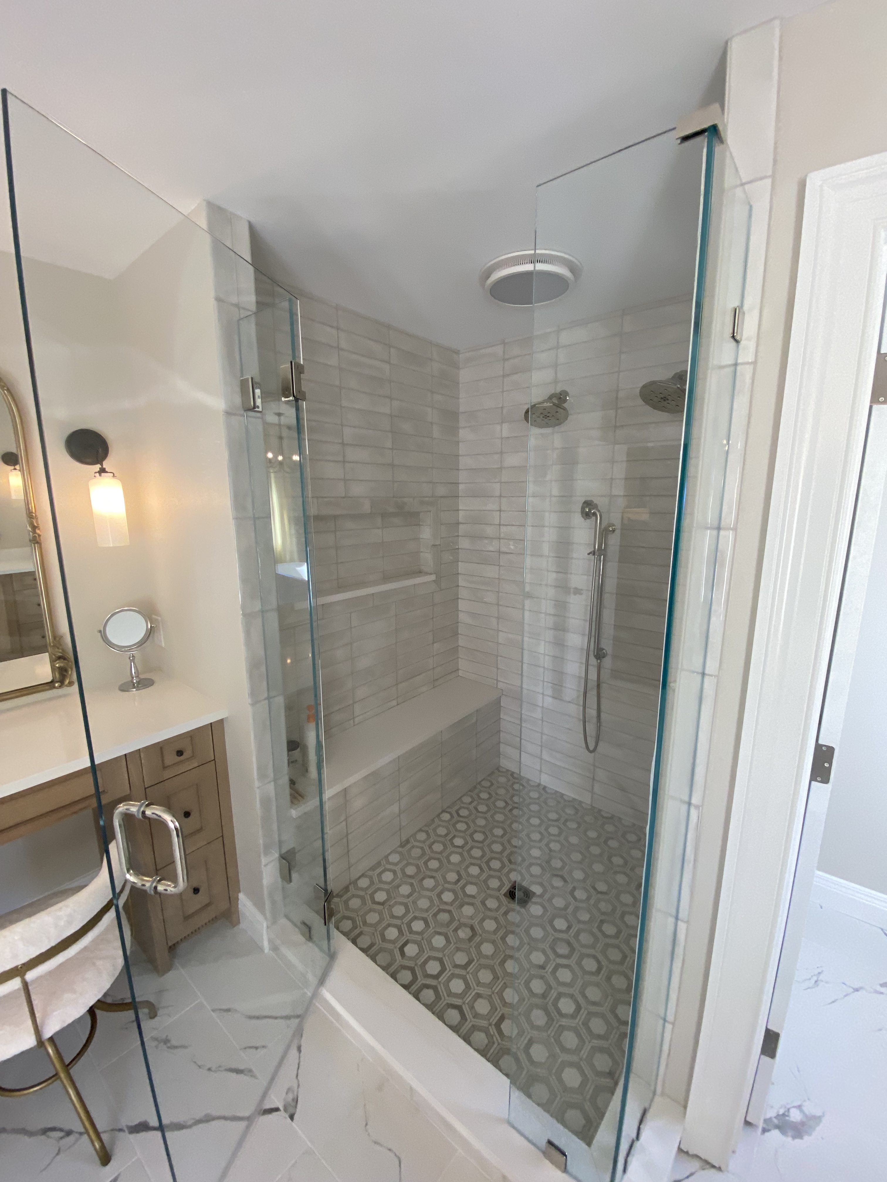 Rolling Hills bathroom — shower interior with subway tile walls, bench, and hexagon mosaic floor